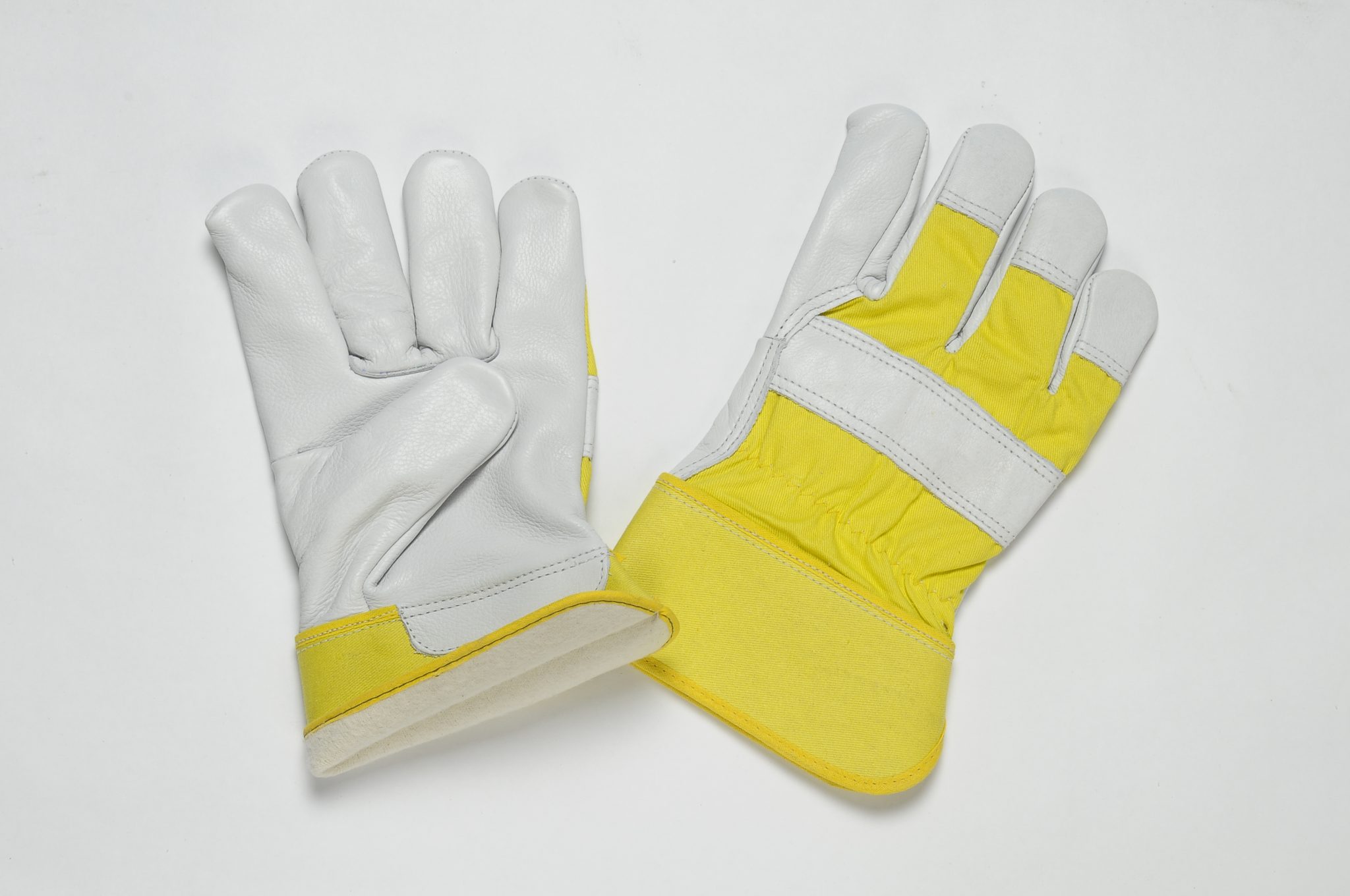 NATURAL GRAIN GLOVES. FULL FLANNEL LINING . YELLOW CUFF & BACK. ADJUSTIBLE ELASTIC IN THE WRIST.