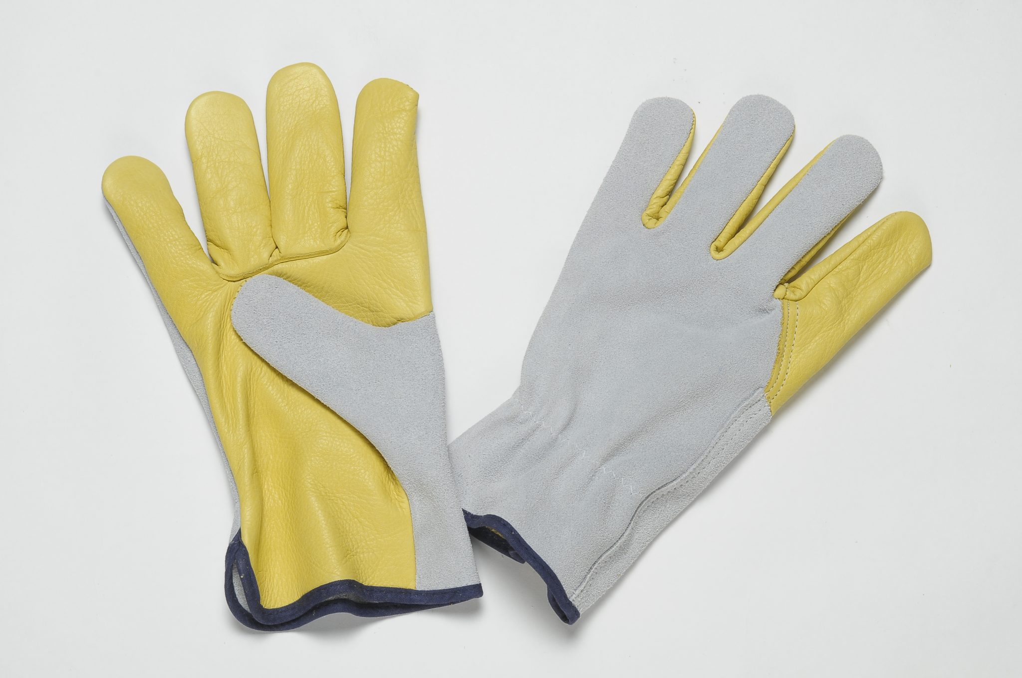 YELLOW LEATHER GLOVES WITH GRAIN ON PALM, THUMB AND FOREFINGER, NATURAL SPLIT BACK, ADJUSTABLE ELASTIC IN THE WRIST, COLOURED BINDING